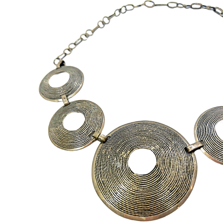 Silver necklace features a unique design