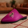 Stylish fuchsia pink babouche slippers with a butterfly pattern